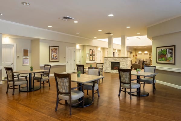 Bright common area with tables and chairs