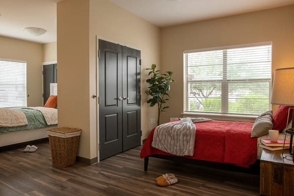 Cozy resident room with a bed and window.