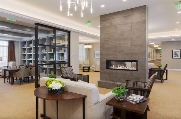 Spacious living room with seating and a fireplace