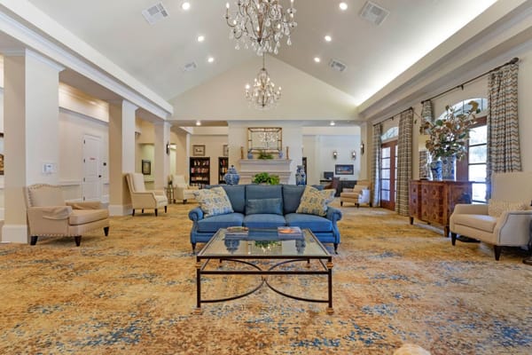 Cozy living room with blue sofa and elegant chandelier