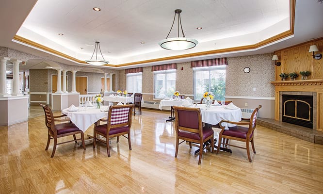 Cozy dining room with tables set for meals