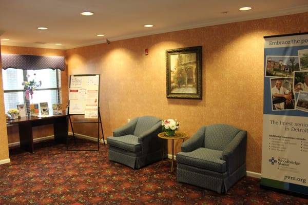 Cozy lobby space with chairs and informational displays
