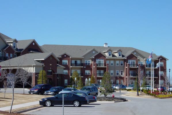 Exterior view of a senior living facility from the parking lot