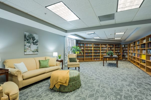 Inviting library area with seating and shelves full of books