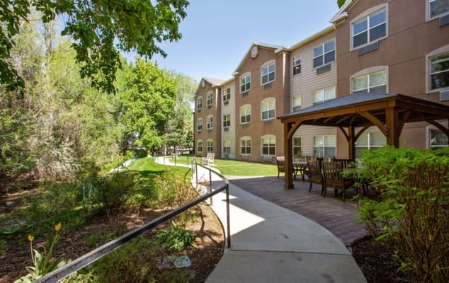Patio with seating near the building at Truewood by Merrill