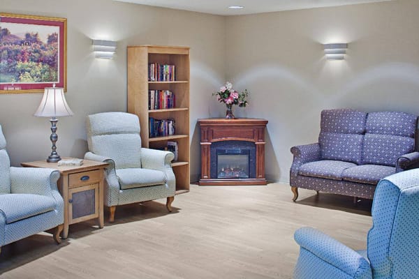 Comfortable seating area with armchairs and a sofa in a well-lit living room