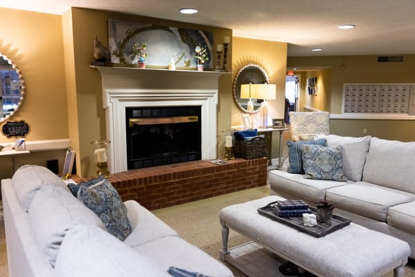 Cozy common area with seating and a fireplace