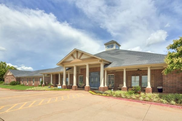 Front entrance of Villagio of Oklahoma City with a clear blue sky