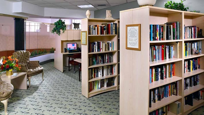 A cozy library area with bookshelves and seating