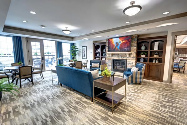 Comfortable common area with seating and a fireplace