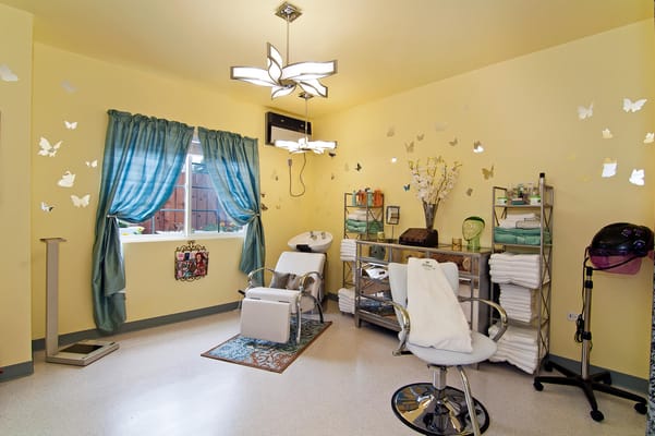 Beauty salon room with styling chairs and decorations