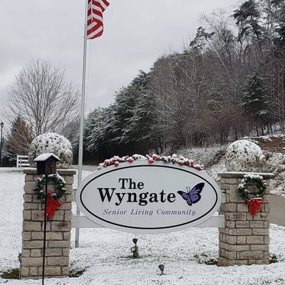 Sign of The Wyngate Senior Living Community in winter