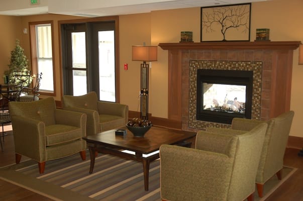 Common area with seating and fireplace