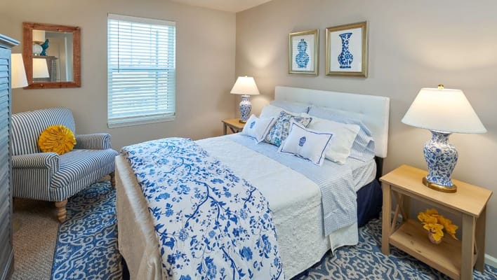 Brightly decorated senior living bedroom with floral accents