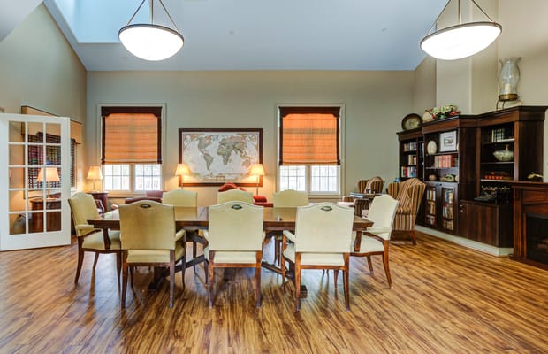 Common area with a large table and world map