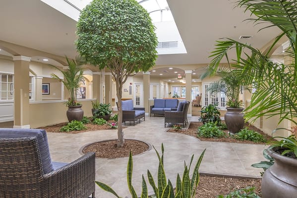 Bright interior common area with plants and seating