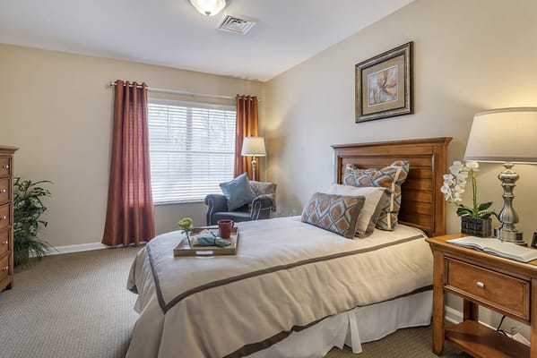 Cozy resident room with bed and seating