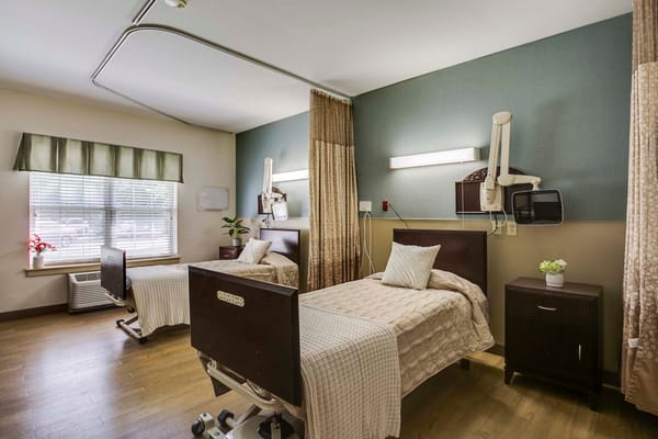 Shared resident room with two beds and window