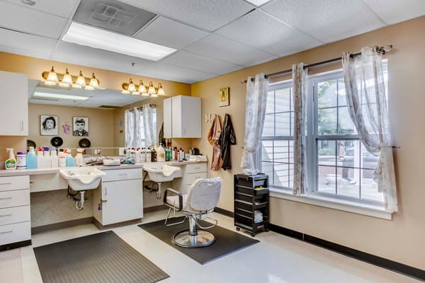 Salon area with styling chairs and products