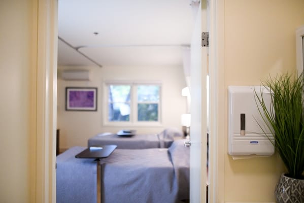 View of a resident room with beds and light.