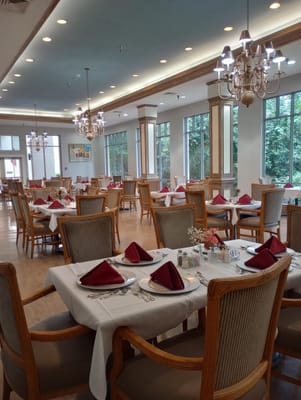 Elegant dining room with tables set for a meal