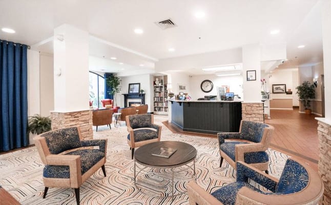 Cozy lobby area with comfortable seating and front desk