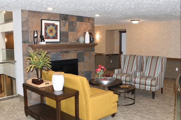 Cozy interior lounge area with seating and a fireplace