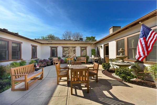 Outdoor patio with seating and garden elements