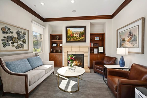 Cozy common area with a fireplace and seating