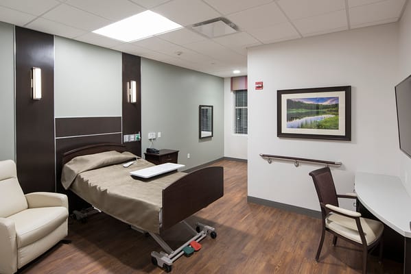 A comfortable private resident room in a nursing facility