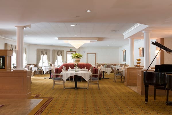 Elegant dining area with tables set for dining