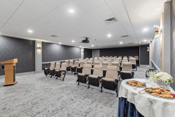 Spacious conference room with seating and refreshments