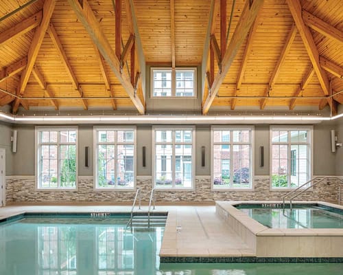 Interior view of a leisure pool area with wooden beams