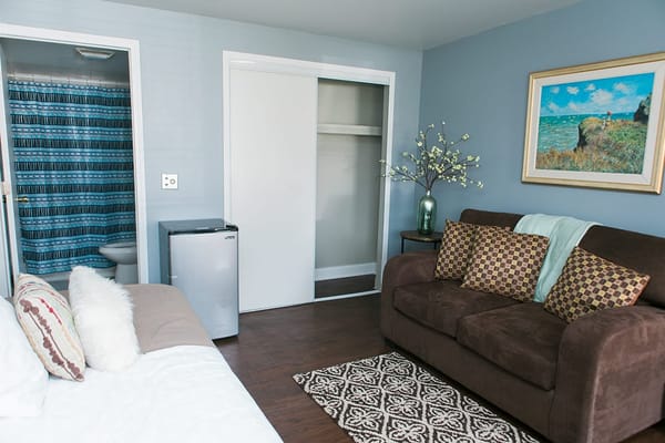 Cozy interior of a resident room with a sofa and decor