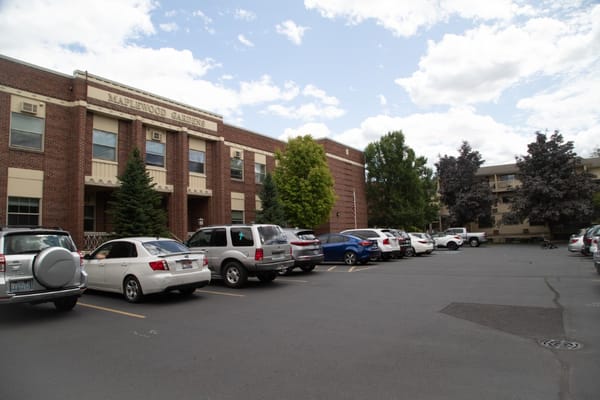 Exterior view of Maplewood Gardens with parking lot