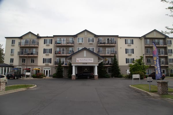 Front view of North Point Village facility with outdoor area