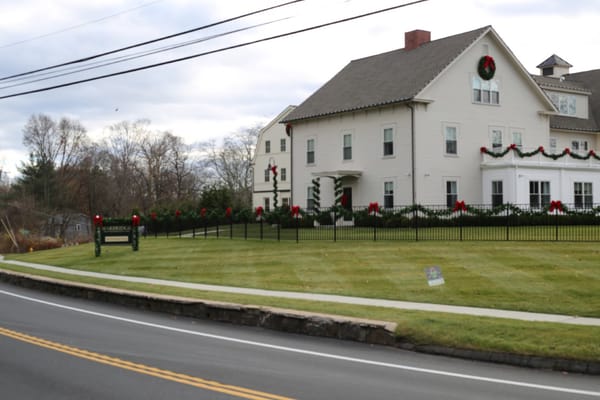 Exterior view of a retirement center decorated for the holidays