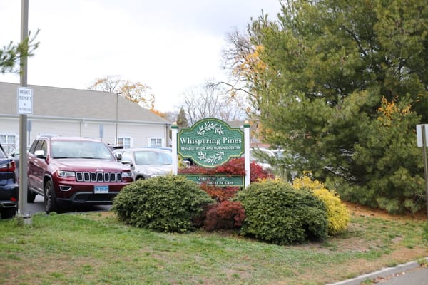 Sign for Whispering Pines Rehabilitation and Nursing Center