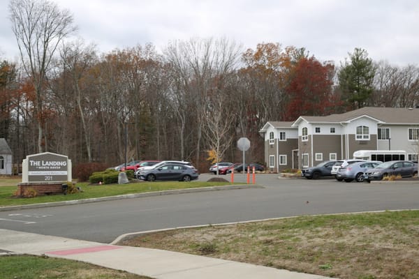 Exterior view of The Landing with parking and landscaping