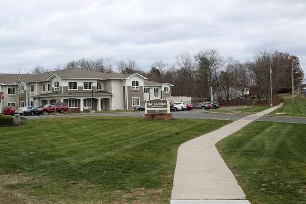 The Landing exterior with landscaping and signage