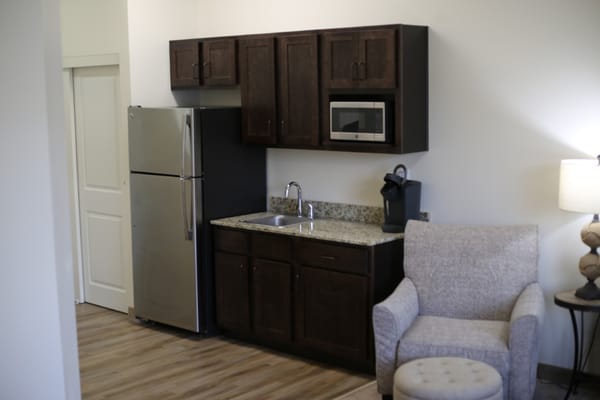 A cozy kitchenette area in a resident room