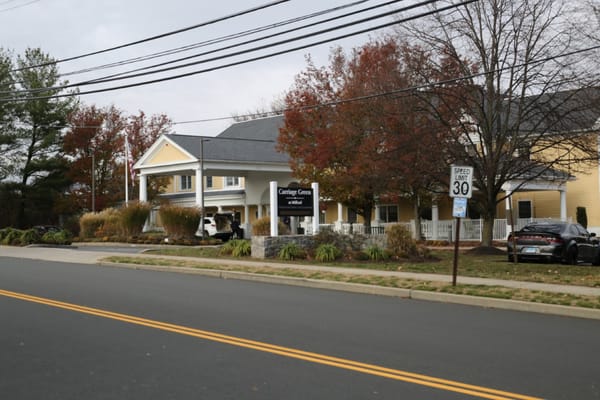 The entrance of Carriage Green at Milford showing the building and landscaping.