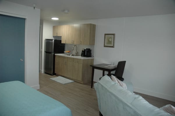 Cozy interior of a resident's suite with kitchenette