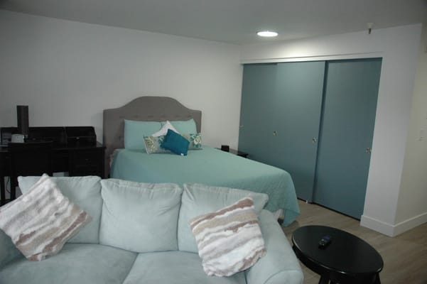 Cozy interior of a resident room with a sofa and bed