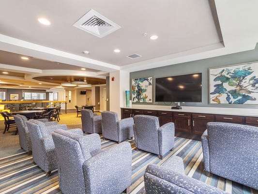 Comfortable common area with seating and artwork