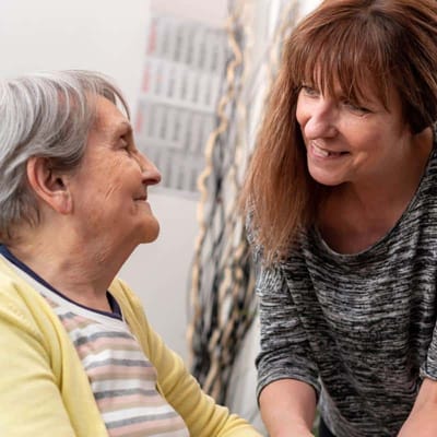 Staff member engaging with a resident indoors