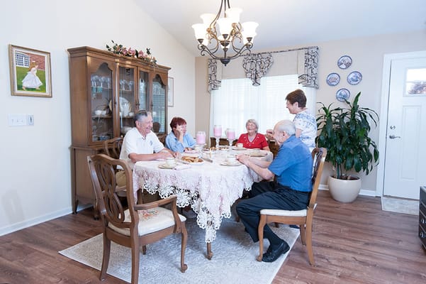 Residents enjoying a meal together in the dining area