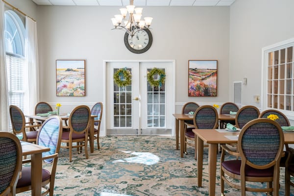 Interior dining area with tables and decorative wreaths