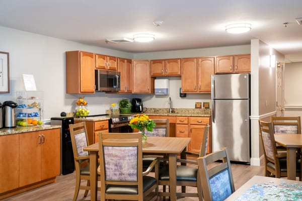 Bright kitchen and dining area in a senior living facility
