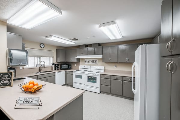 A bright kitchen space with a gathering area